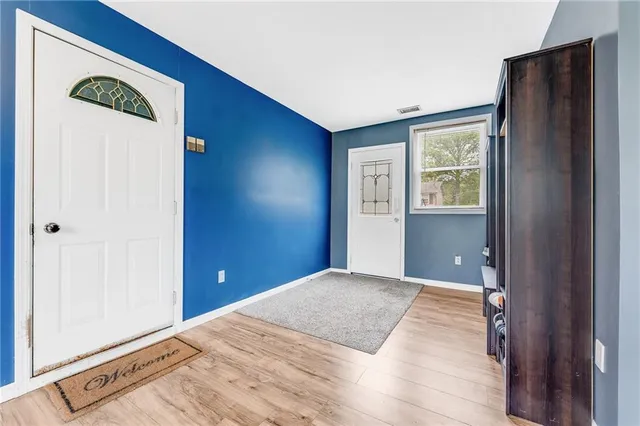 a view of a livingroom with an empty space and a window