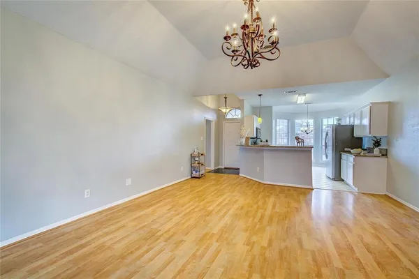 a view of a kitchen with a sink and cabinets