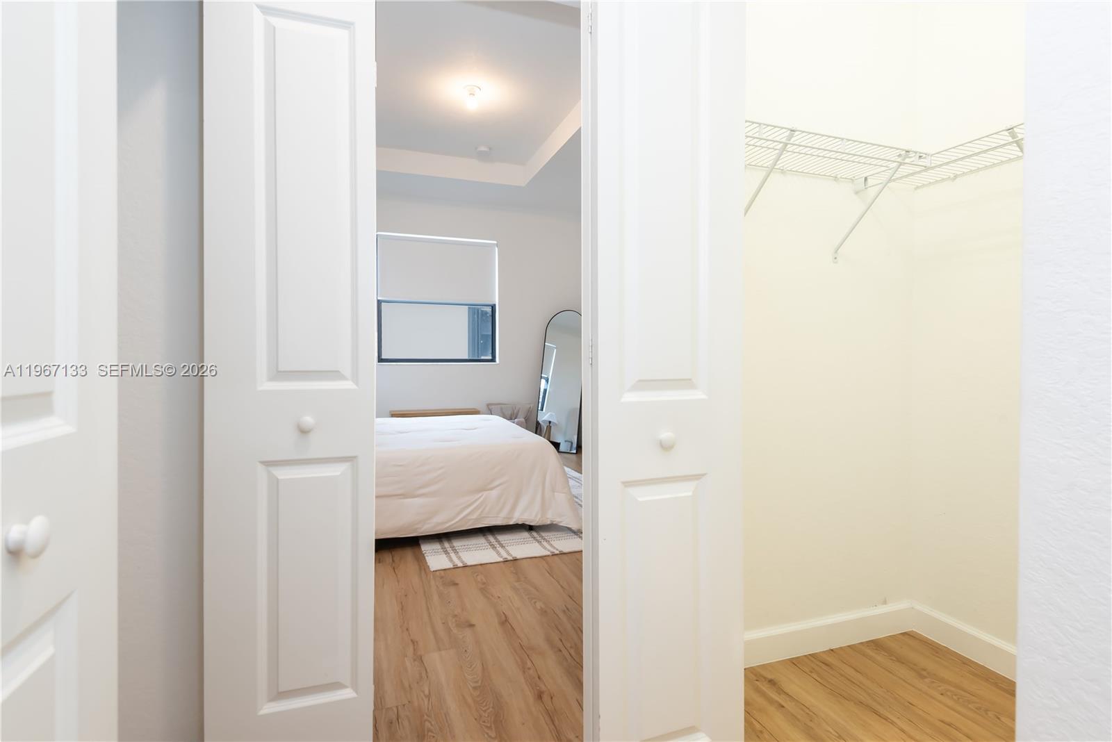 25128 Southwest 113th Place Homestead, FL 33032 - Photo 22 of 39 a bedroom with a bed and a table