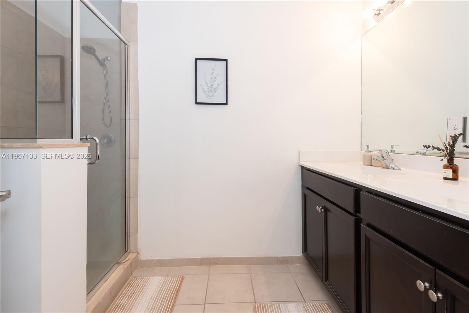 25128 Southwest 113th Place Homestead, FL 33032 - Photo 23 of 39 a room with a sink and a mirror