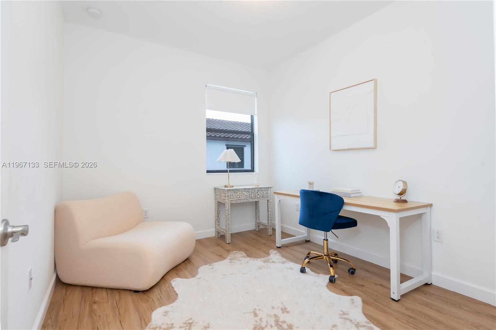 25128 Southwest 113th Place Homestead, FL 33032 - Photo 25 of 39 a workspace with furniture and a wooden floor