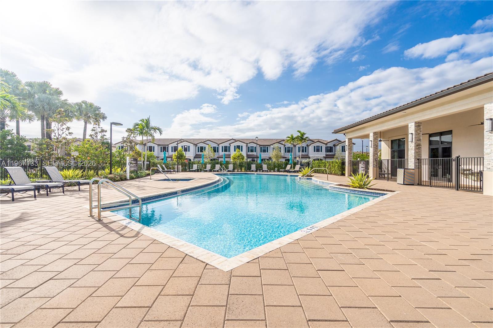 25128 Southwest 113th Place Homestead, FL 33032 - Photo 37 of 39 a view of swimming pool with outdoor seating and plants