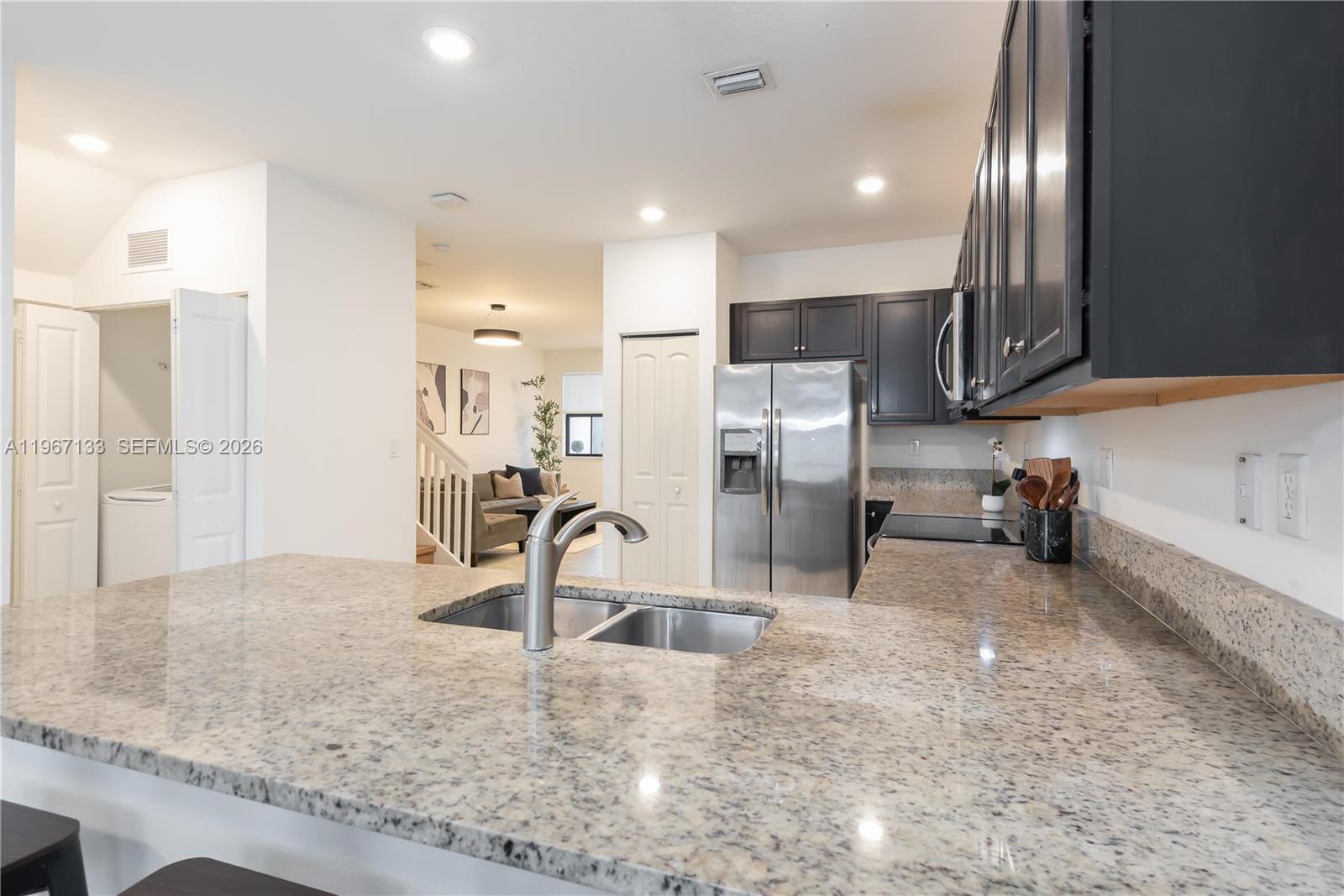 25128 Southwest 113th Place Homestead, FL 33032 - Photo 8 of 39 a kitchen with refrigerator and sink