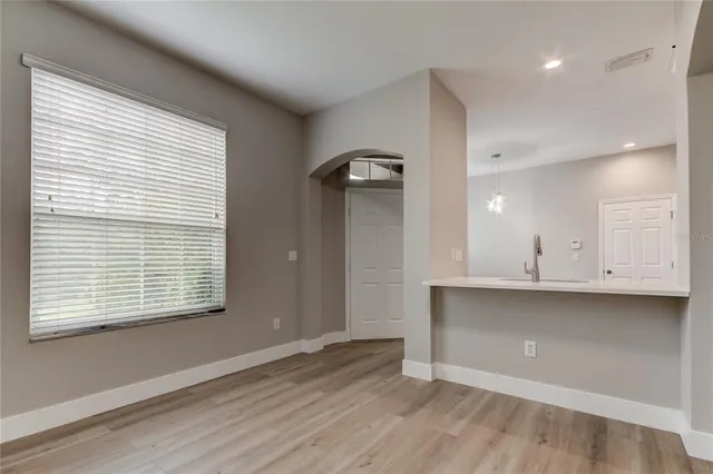 a view of a kitchen with a dishwasher and a window