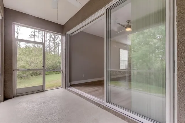 a bathroom with a glass shower door and a glass door