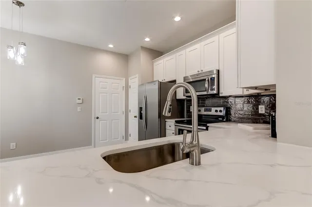 a view of kitchen and sink