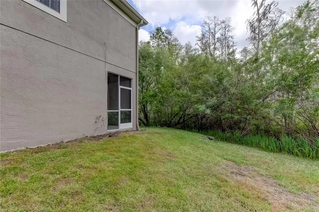 a backyard of a house with lots of green space