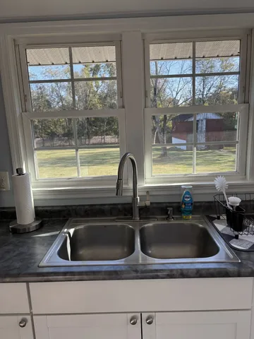 a close view of a sink and a window