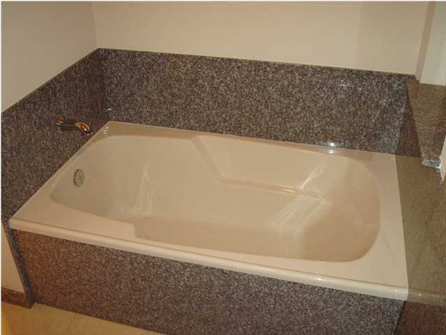 5237 Moore Loop Crestview, FL 32536 - Photo 11 of 17 a bathroom with a bathtub