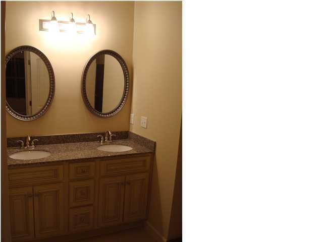 5237 Moore Loop Crestview, FL 32536 - Photo 13 of 17 a bathroom with a granite countertop double vanity sink and a mirror