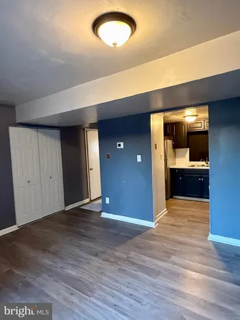 a kitchen with a refrigerator and a sink