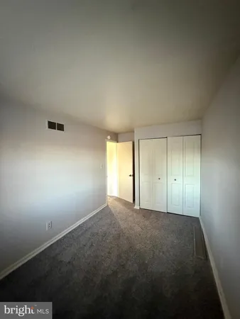 a bathroom with a toilet and shower