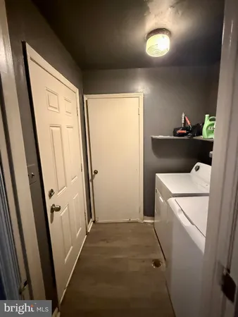 a bathroom with a double vanity sink and mirror