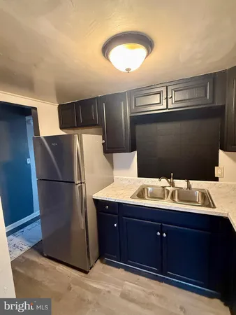 a kitchen with stainless steel appliances granite countertop a stove and a microwave