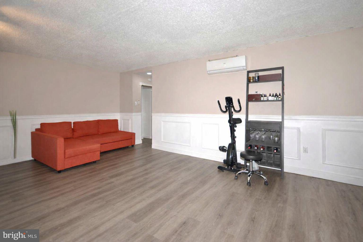 110 Byberry Road, Unit E2 Philadelphia, PA 19116 - Photo 4 of 10 a view of a room with gym equipment and a table