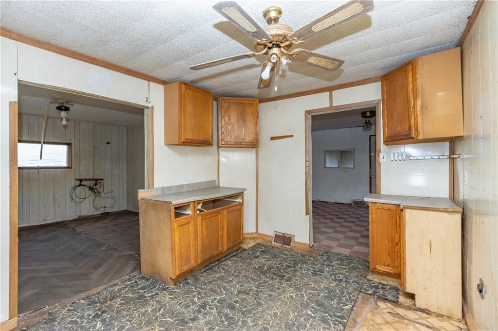 2065 1st Street Apollo, PA 15613 - Photo 3 of 16 a view of a kitchen with a sink stainless steel appliances wooden floor and cabinets