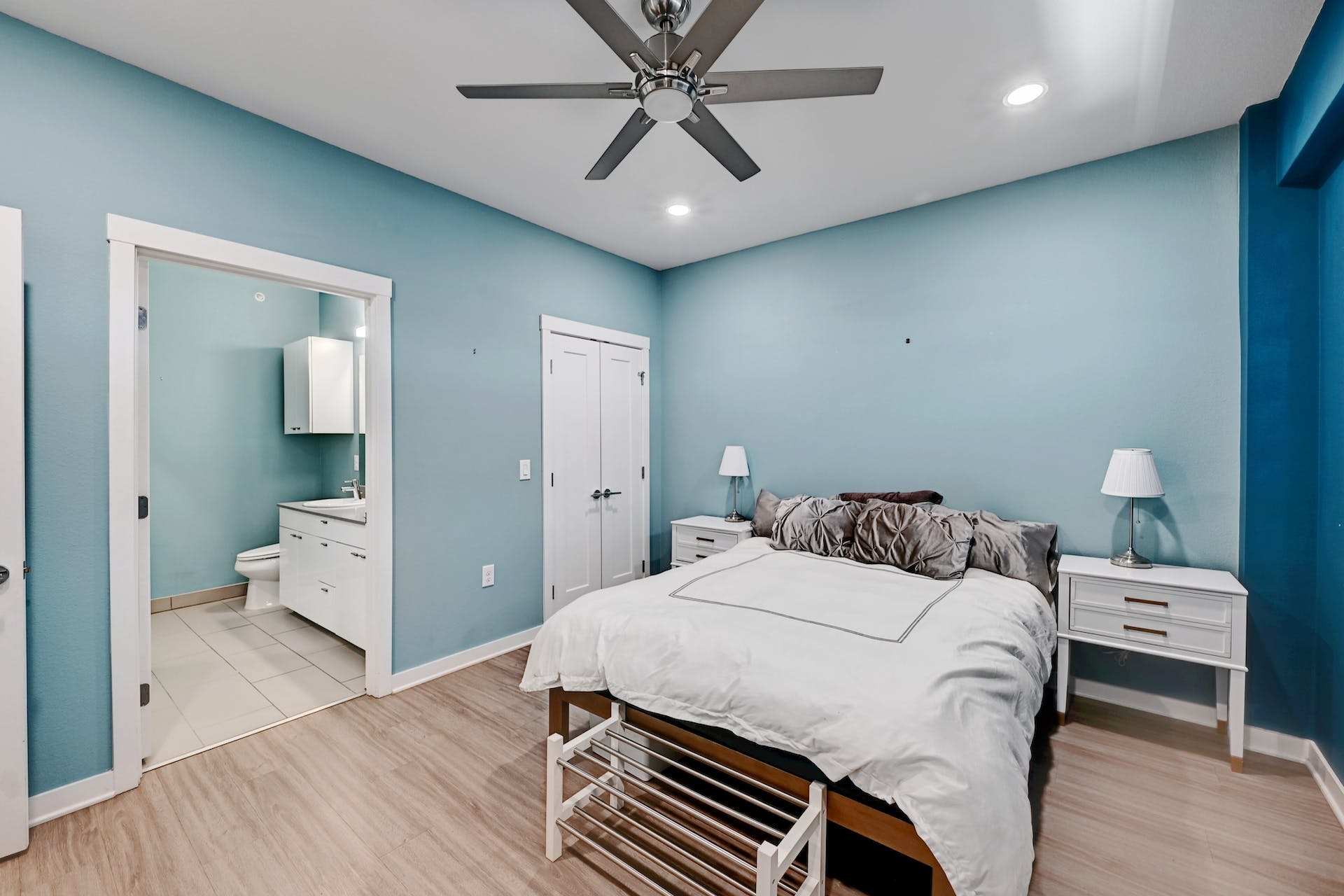 4361 South Congress Avenue, Unit 336 Austin, TX 78745 - Photo 11 of 30 a bedroom with a bed and a chandelier