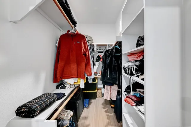 a view of a hallway with washer and dryer