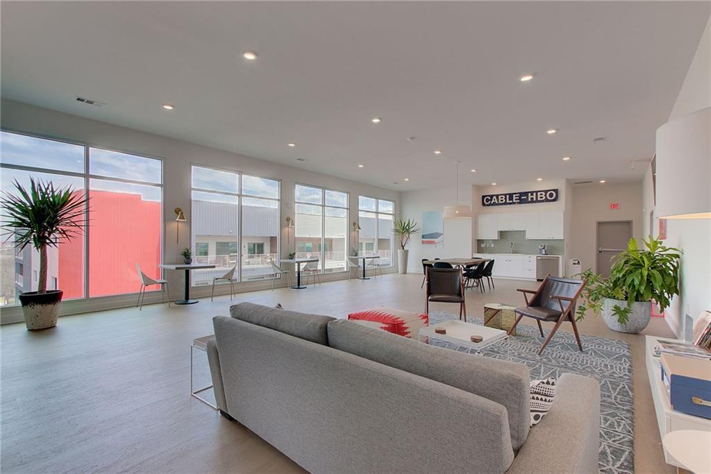 4361 South Congress Avenue, Unit 336 Austin, TX 78745 - Photo 25 of 30 a living room with furniture and a large window