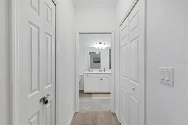 a bathroom with a sink a toilet a mirror a vanity and shower