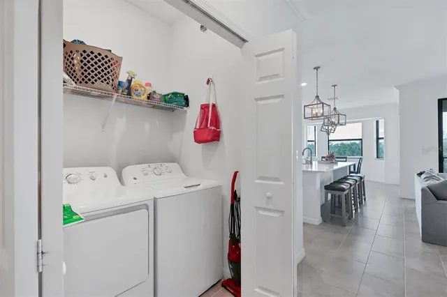 an aerial view of a house with a garden and lake view