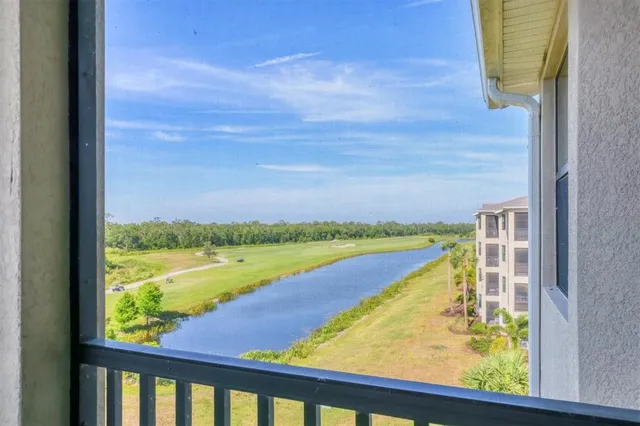 a view of a lake with a building in the background