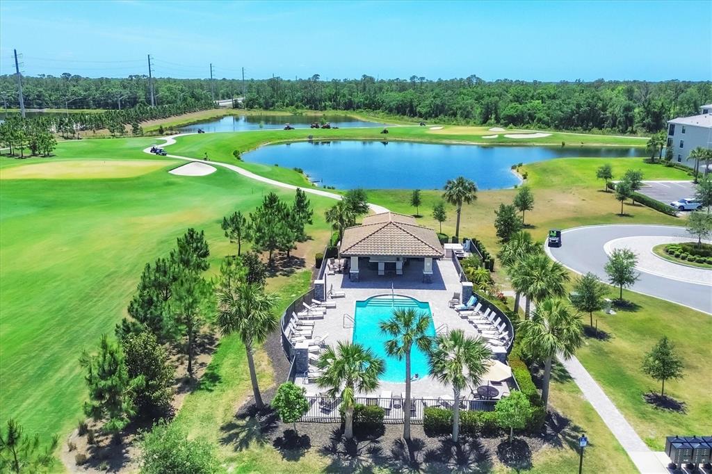 18114 Gawthrop Drive, Unit 405 Bradenton, FL 34211 - Photo 32 of 72 an aerial view of a house with a garden and lake view