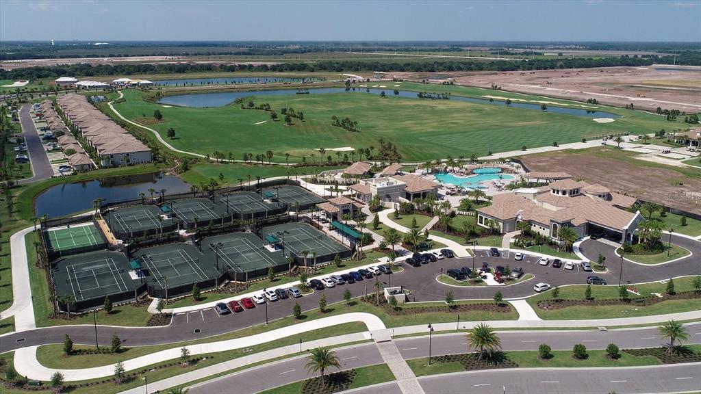18114 Gawthrop Drive, Unit 405 Bradenton, FL 34211 - Photo 34 of 72 a view of a lake with a building in the background