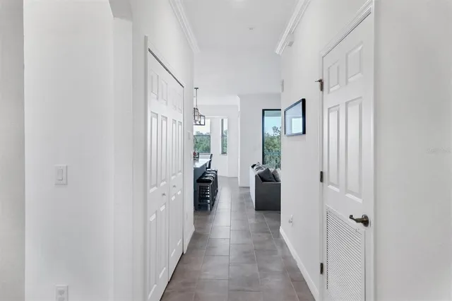 a living room with furniture and a ceiling fan