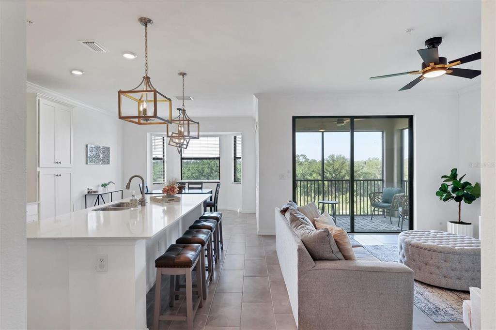 18114 Gawthrop Drive, Unit 405 Bradenton, FL 34211 - Photo 5 of 72 a living room with furniture and a large window