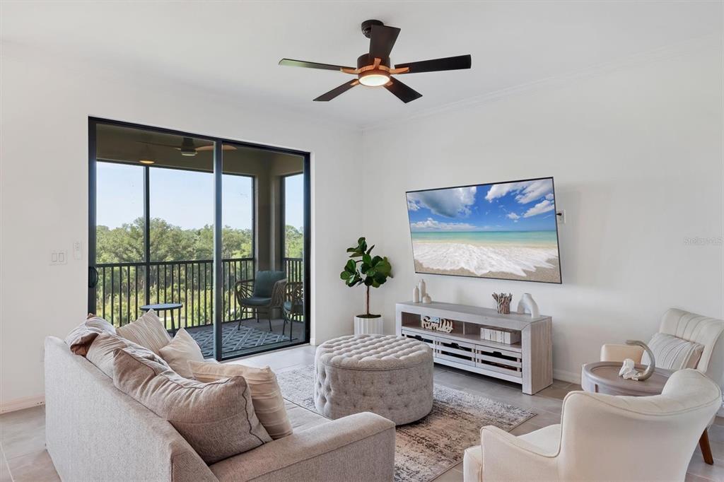 18114 Gawthrop Drive, Unit 405 Bradenton, FL 34211 - Photo 6 of 72 a living room with furniture and a ceiling fan