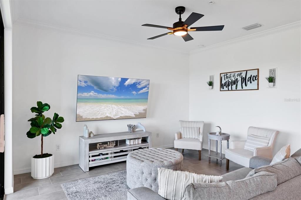 18114 Gawthrop Drive, Unit 405 Bradenton, FL 34211 - Photo 7 of 72 a living room with furniture and a potted plant