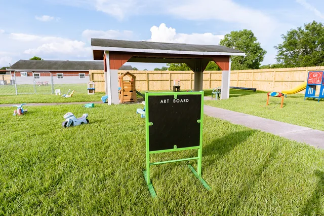 a view of a backyard with sitting area