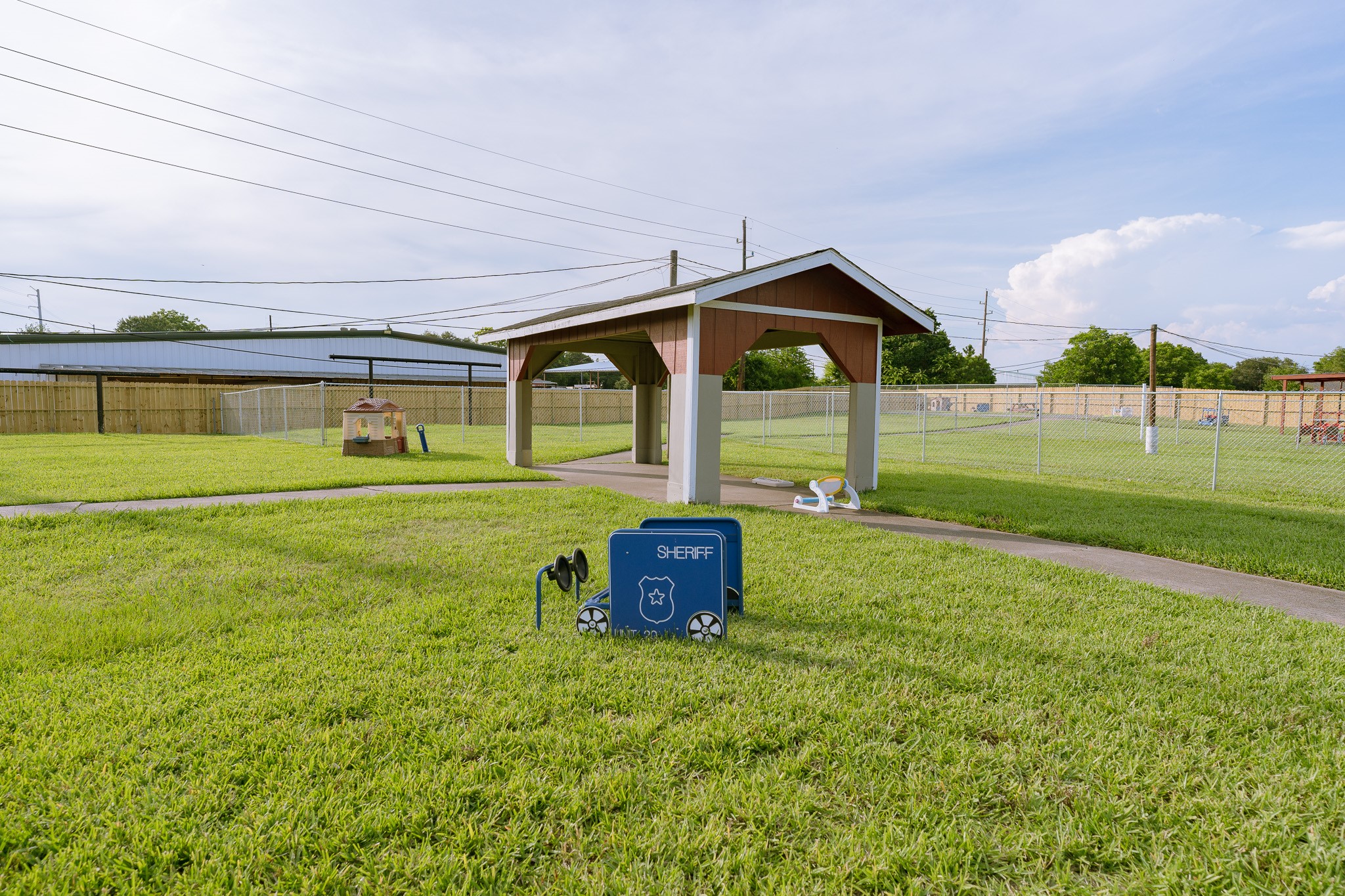 5111 Powerline Road Richmond, TX 77469 - Photo 20 of 22 a front view of a house with garden