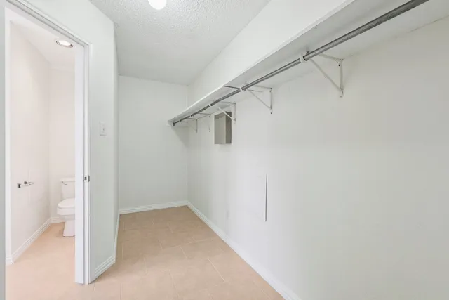 a bathroom with a sink double vanity mirror and a bathtub