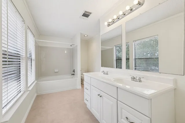 a bathroom with a bathtub and a sink