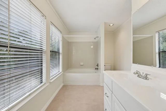 a bathroom with a double vanity sink and mirror