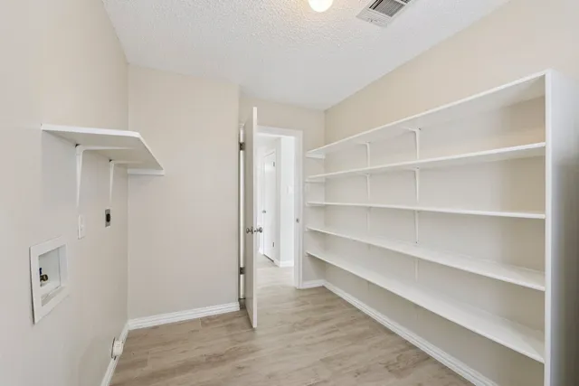 a view of an empty walk in closet