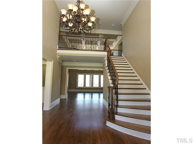 11220 Conley Cove Court Raleigh, NC 27613 - Photo 4 of 25 The wonder continues in this large open foyer, with views of the large dining room, beautiful hardwood floors through out the first floor.