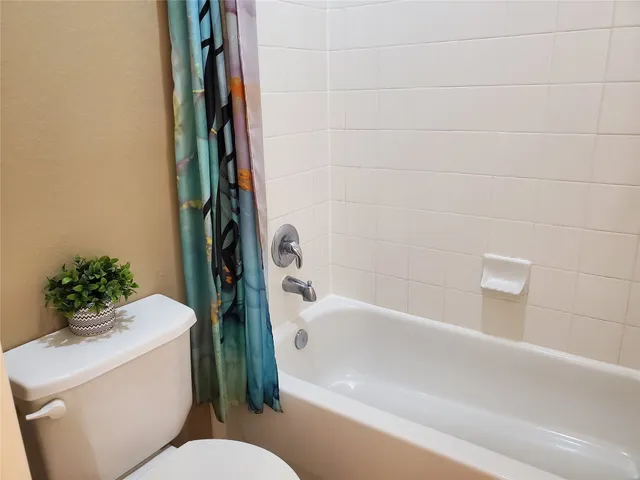 a kitchen with granite countertop a sink stainless steel appliances and cabinets