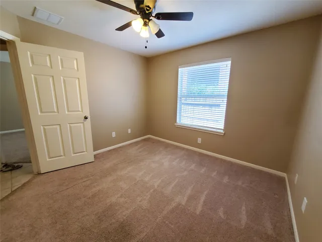 a kitchen with a sink and a wooden cabinets