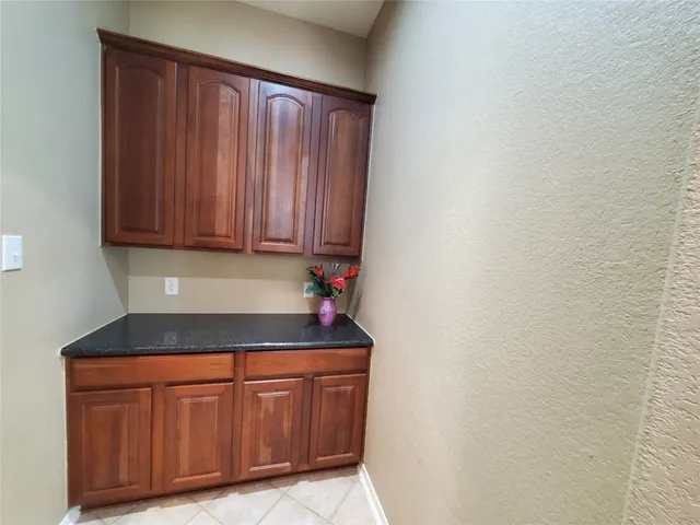 a bathroom with a double vanity sink mirror and a bathtub