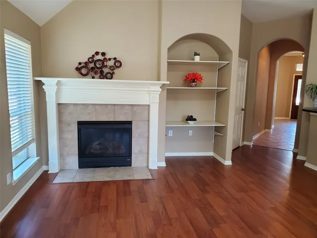 a bathroom with a sink a potted plant and a shower