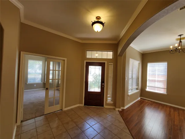 a view of a livingroom with a fireplace and wooden floor