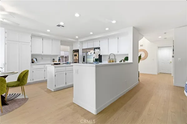 a view of backyard with swimming pool and outdoor seating