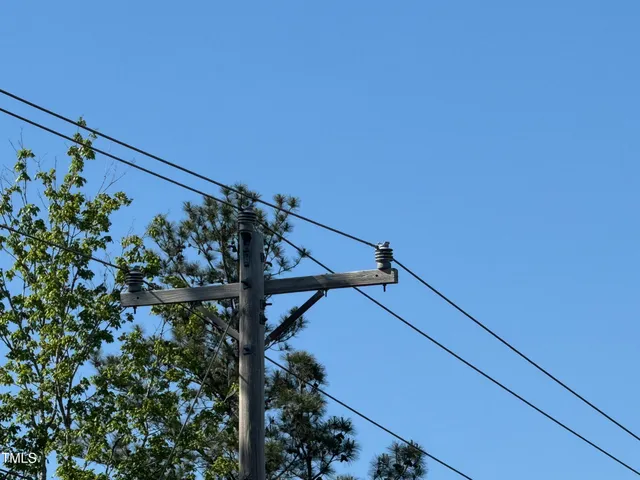 a backyard of a house with portable swimming pool and basket ball court
