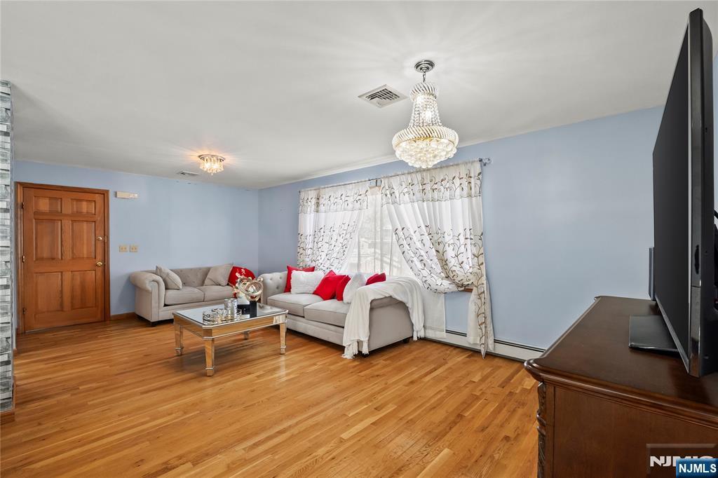 391 Taylor, Unit 2 Hackensack, NJ 07601 - Photo 2 of 15 a living room with furniture and a window