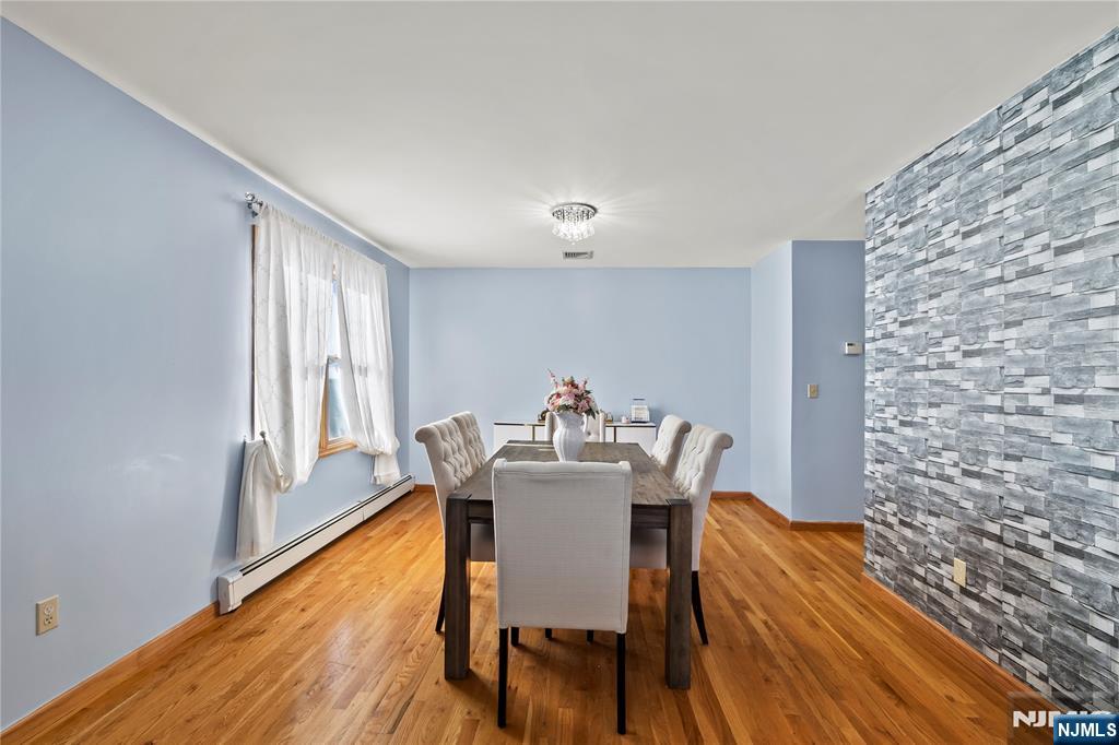 391 Taylor, Unit 2 Hackensack, NJ 07601 - Photo 6 of 15 a view of a dining room with furniture and a window