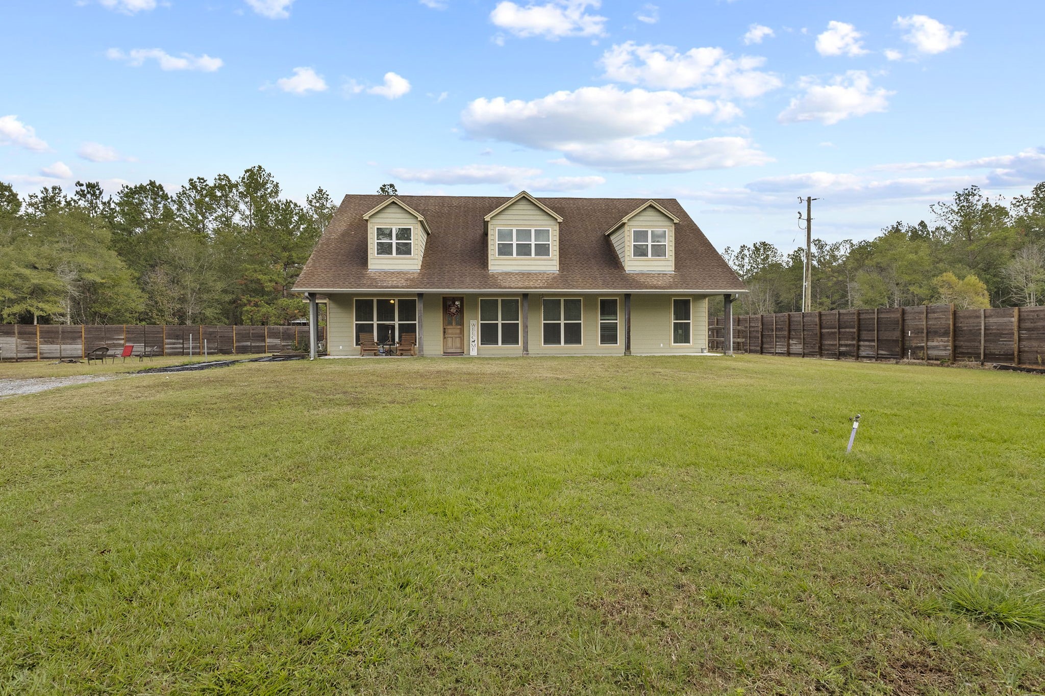 a front view of a house with a yard
