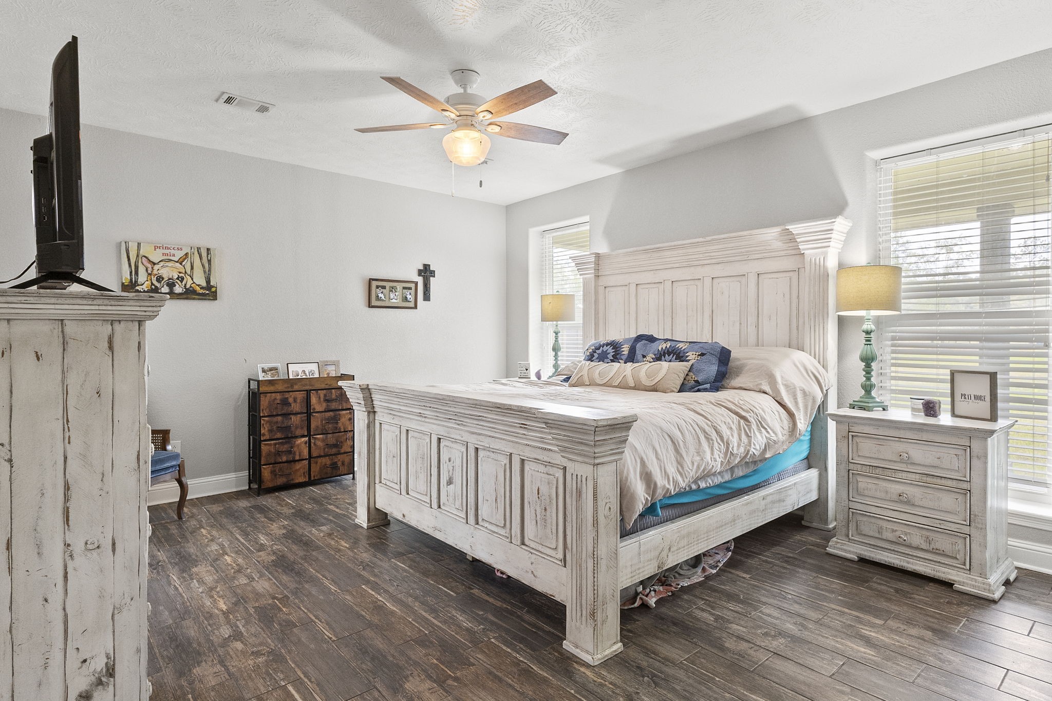 6938 Old Honey Island Road Kountze, TX 77625 - Photo 14 of 34 a bedroom with a bed chandelier and a window